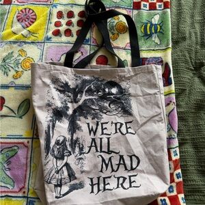Purple Alice In Wonderland We’re All Mad Here Purple And Black Tote Bag